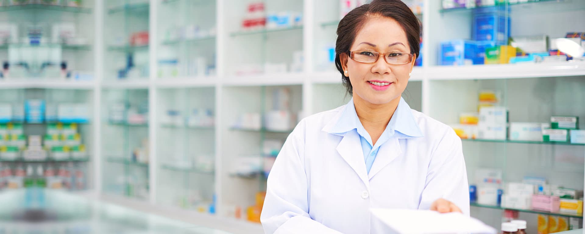pharmacist smiling on the pharmacy